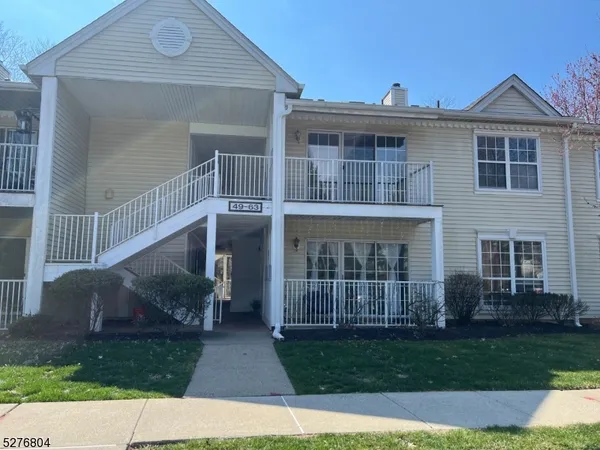 a view of house with a yard