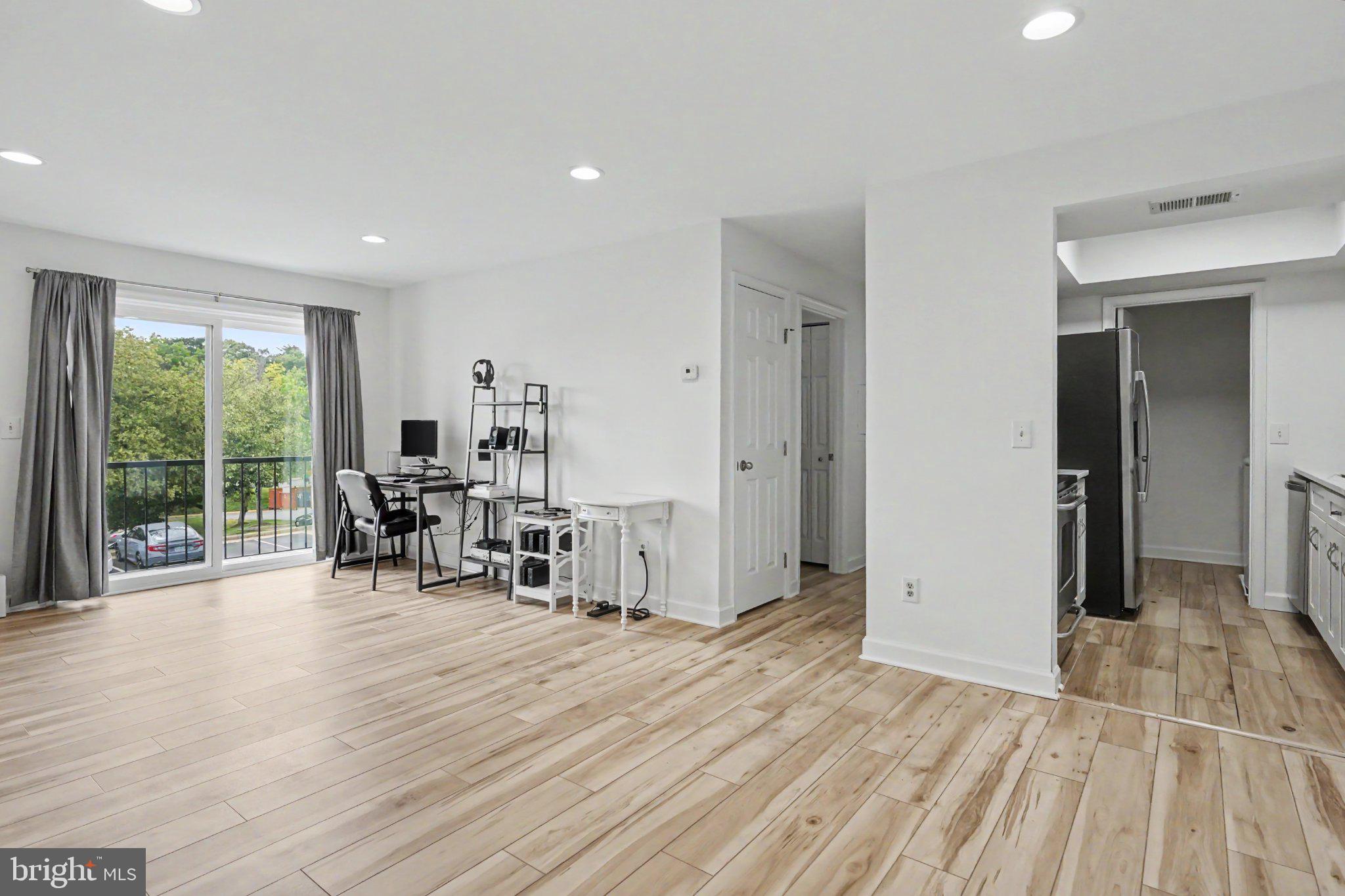14800 Rydell Road, Unit 201 Centreville, VA 20121 - Photo 3 of 28 Bright and airy open living space.
