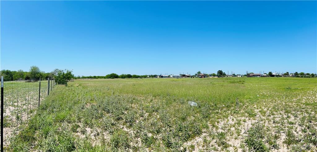 9127 Vista Ridge Drive Edcouch, TX 78538 - Photo 2 of 3 a view of a lake with houses in the back