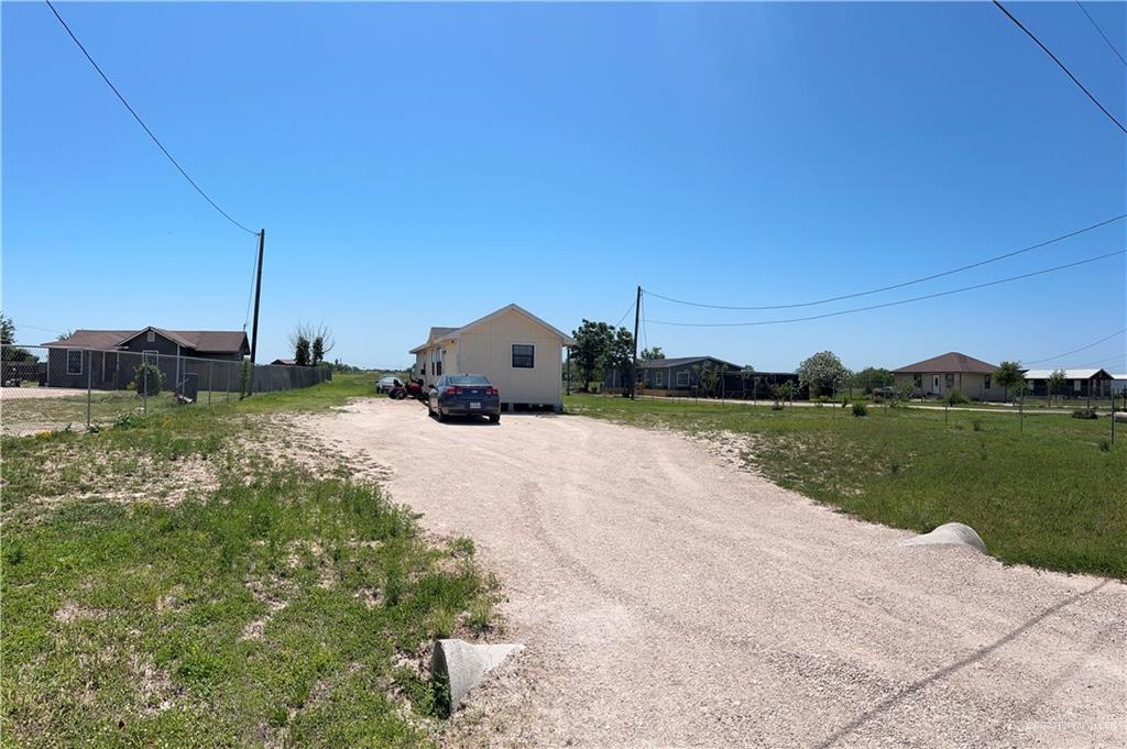 9127 Vista Ridge Drive Edcouch, TX 78538 - Photo 3 of 3 a view of a house with a yard and lake view