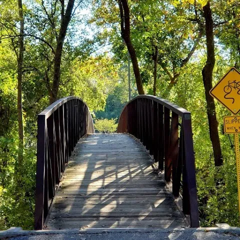 a view of a pathway with a bench