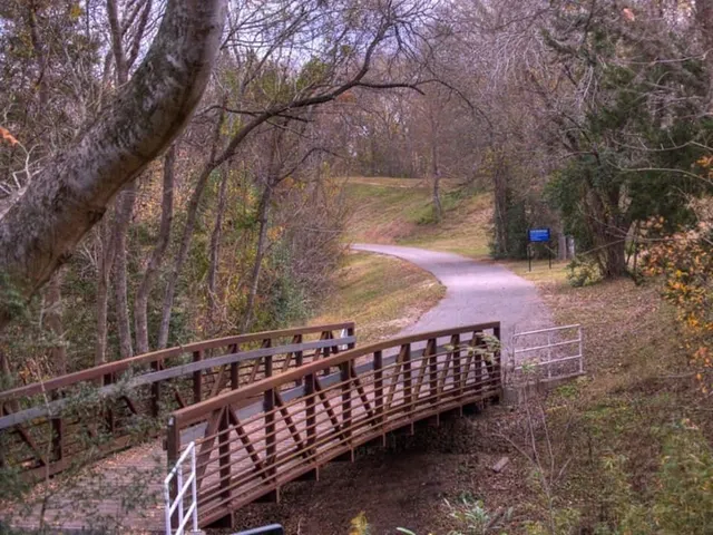 a view of a pathway with a bench