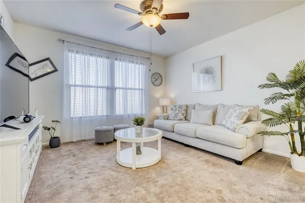 a living room with furniture and a window