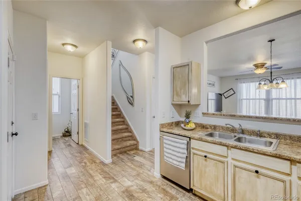 a bathroom with double vanity and a mirror
