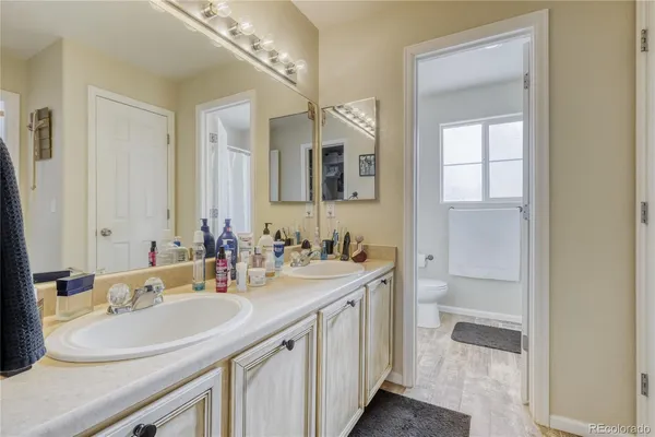 a bathroom with a sink double vanity and a mirror