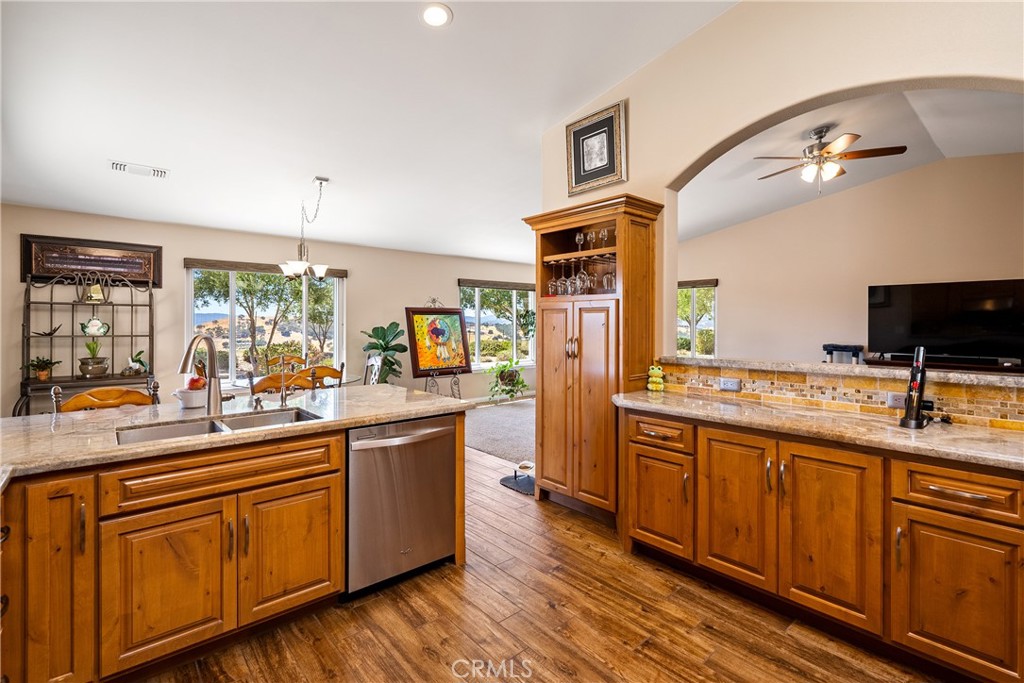 a kitchen with stainless steel appliances a sink and a stove