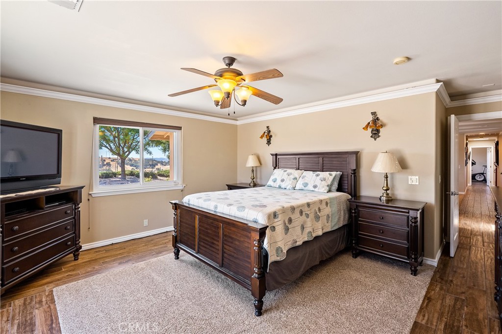 2255 Lothar Lane Templeton, CA 93465 - Photo 15 of 41 a bedroom with a bed and a chandelier