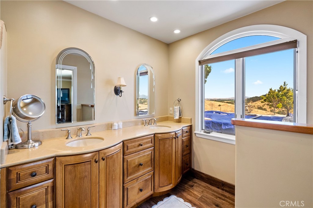 2255 Lothar Lane Templeton, CA 93465 - Photo 17 of 41 a bathroom with a double vanity sink and a mirror