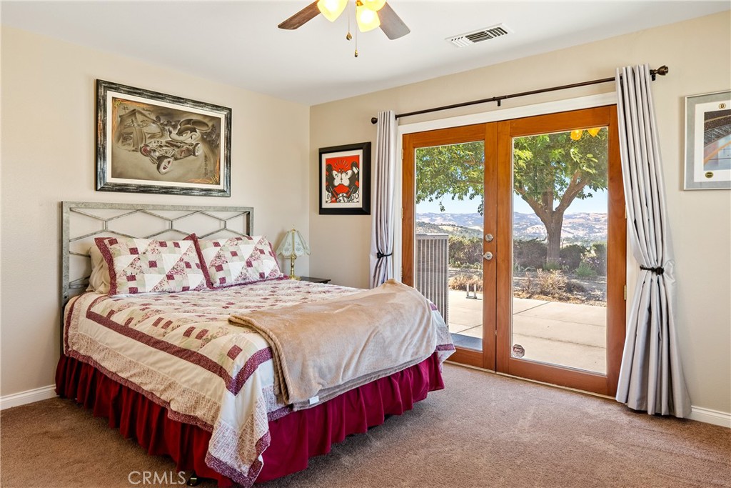 2255 Lothar Lane Templeton, CA 93465 - Photo 23 of 41 a bedroom with a large bed and a large window