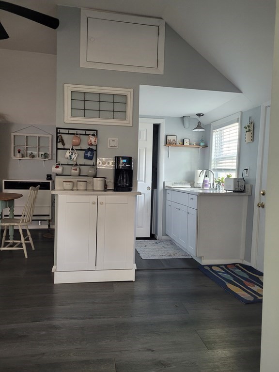21 Thompson Road, Unit 21 Bourne, MA 02532 - Photo 9 of 24 a kitchen with stainless steel appliances a white stove top oven sink and cabinets