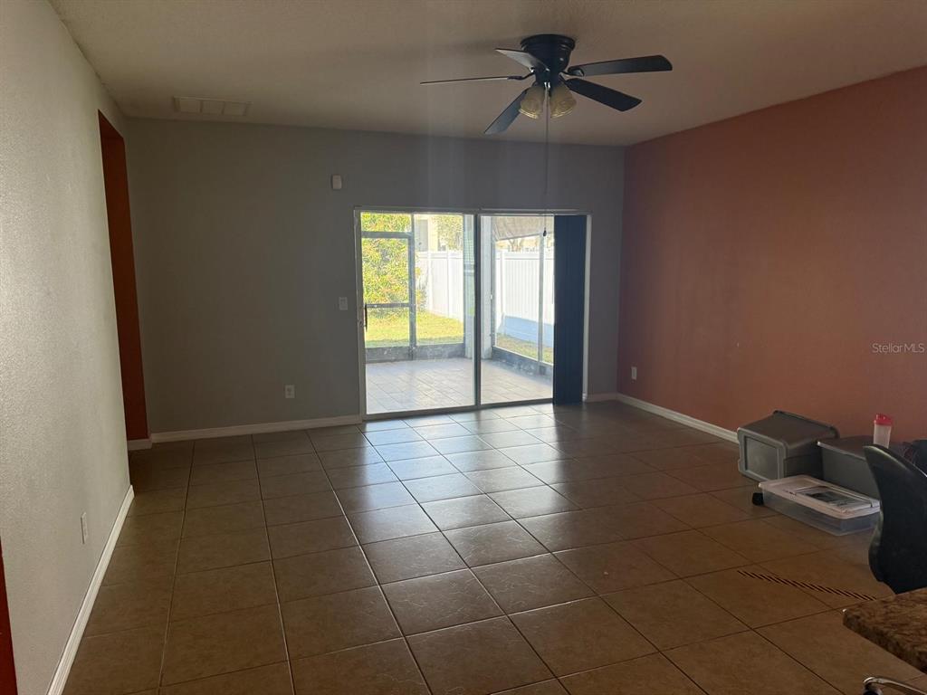 622 Samuel Place Davenport, FL 33837 - Photo 15 of 64 a view of an empty room with a window
