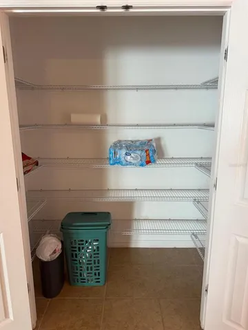 a bathroom with a bathtub and a window