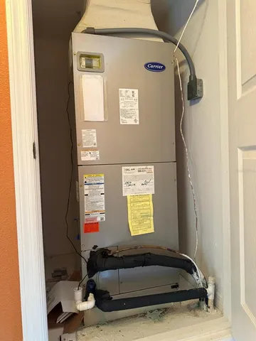 a view of a kitchen with a refrigerator and a stove top oven
