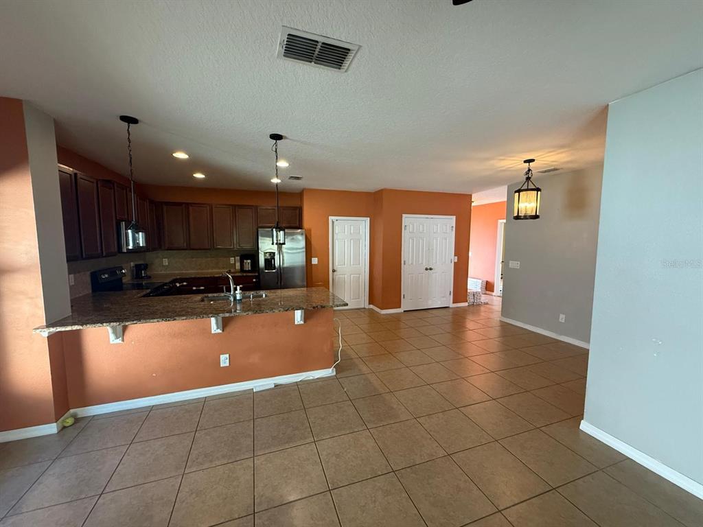 622 Samuel Place Davenport, FL 33837 - Photo 20 of 64 a view of a kitchen with a sink and cabinets
