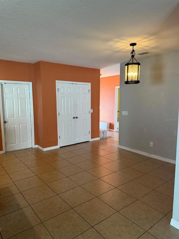 622 Samuel Place Davenport, FL 33837 - Photo 27 of 64 an empty room with windows and closet