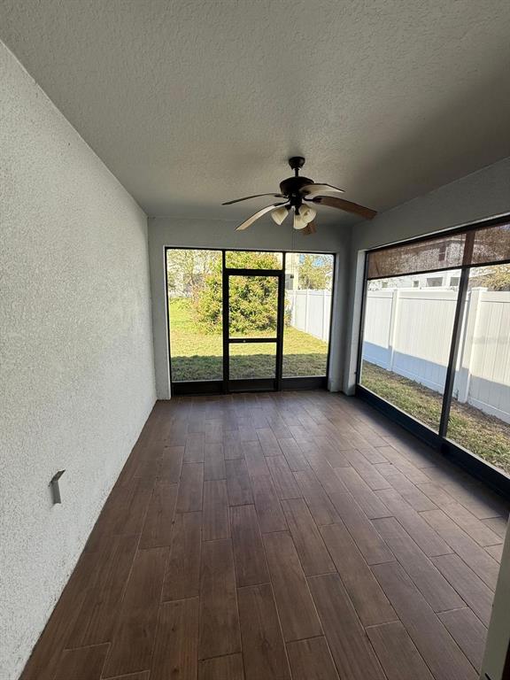 622 Samuel Place Davenport, FL 33837 - Photo 33 of 64 wooden floor in an empty room with a window