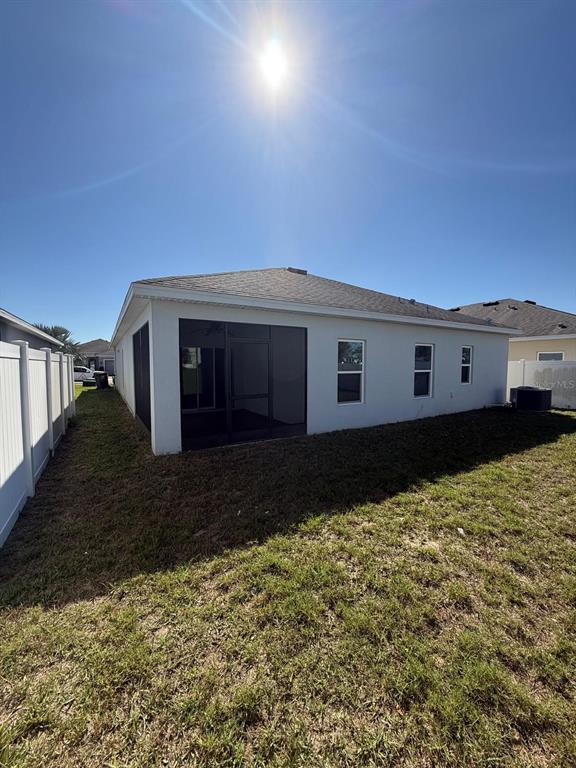 622 Samuel Place Davenport, FL 33837 - Photo 38 of 64 a front view of a house with a yard