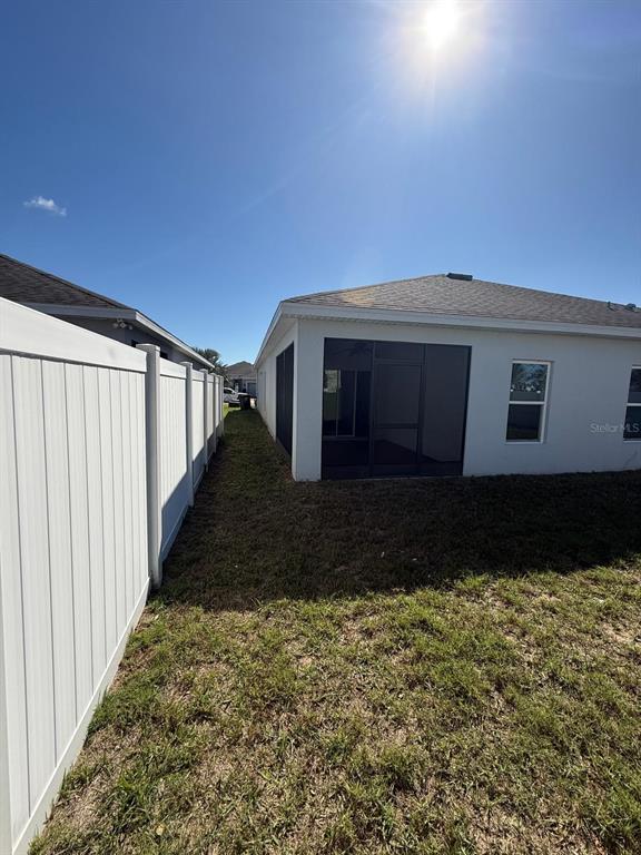 622 Samuel Place Davenport, FL 33837 - Photo 46 of 64 a front view of a house with a yard