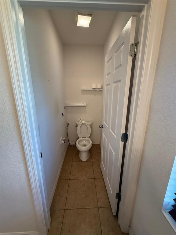 622 Samuel Place Davenport, FL 33837 - Photo 49 of 64 a bathroom with a sink and toilet