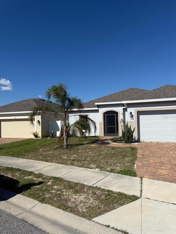 622 Samuel Place Davenport, FL 33837 - Photo 60 of 64 a view of a house with a yard