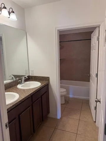 a bathroom with a toilet and a bathtub