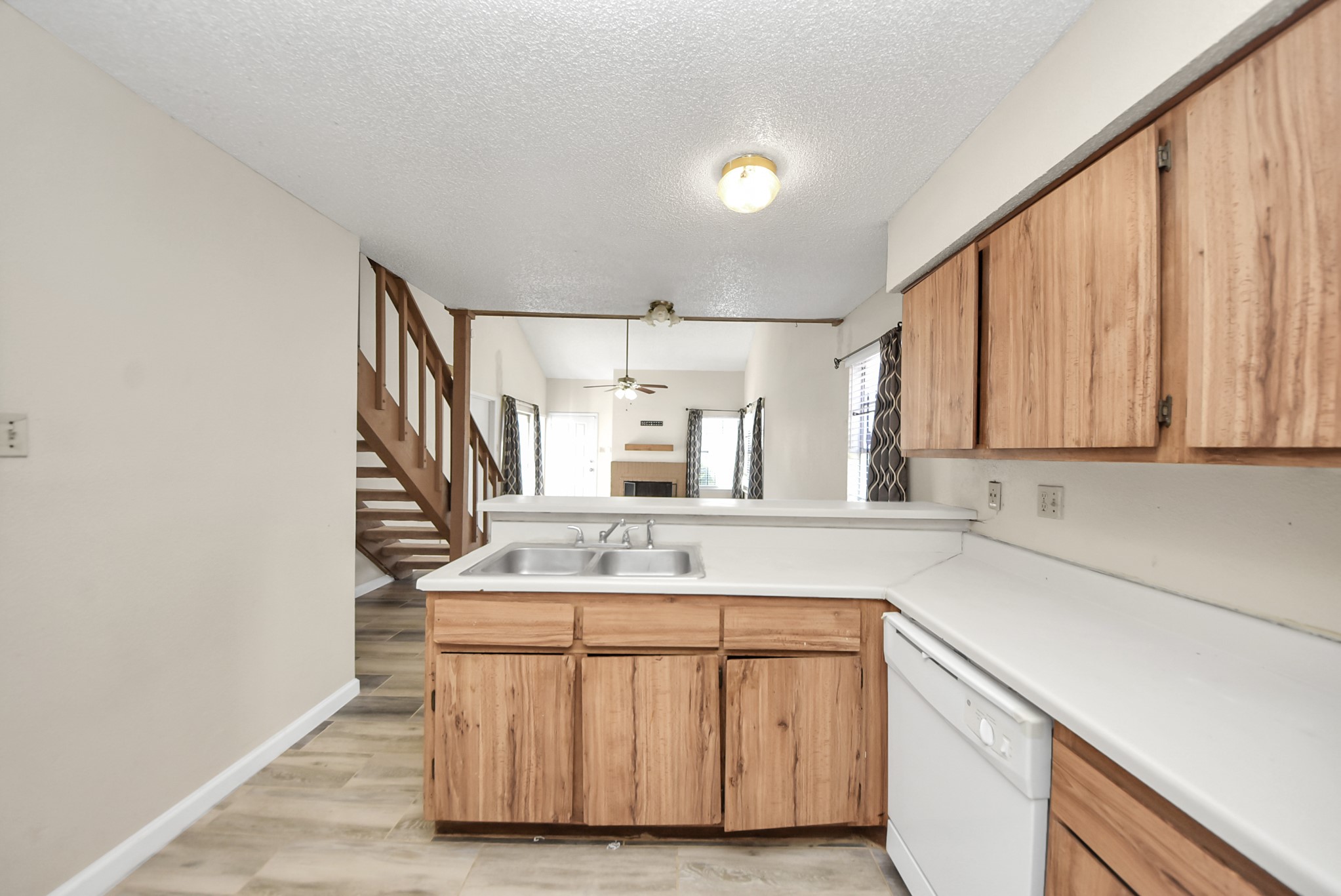 12232 Copper Tree Pvt Lane, Unit 122 Houston, TX 77035 - Photo 14 of 41 a bathroom with a sink a mirror and cabinets