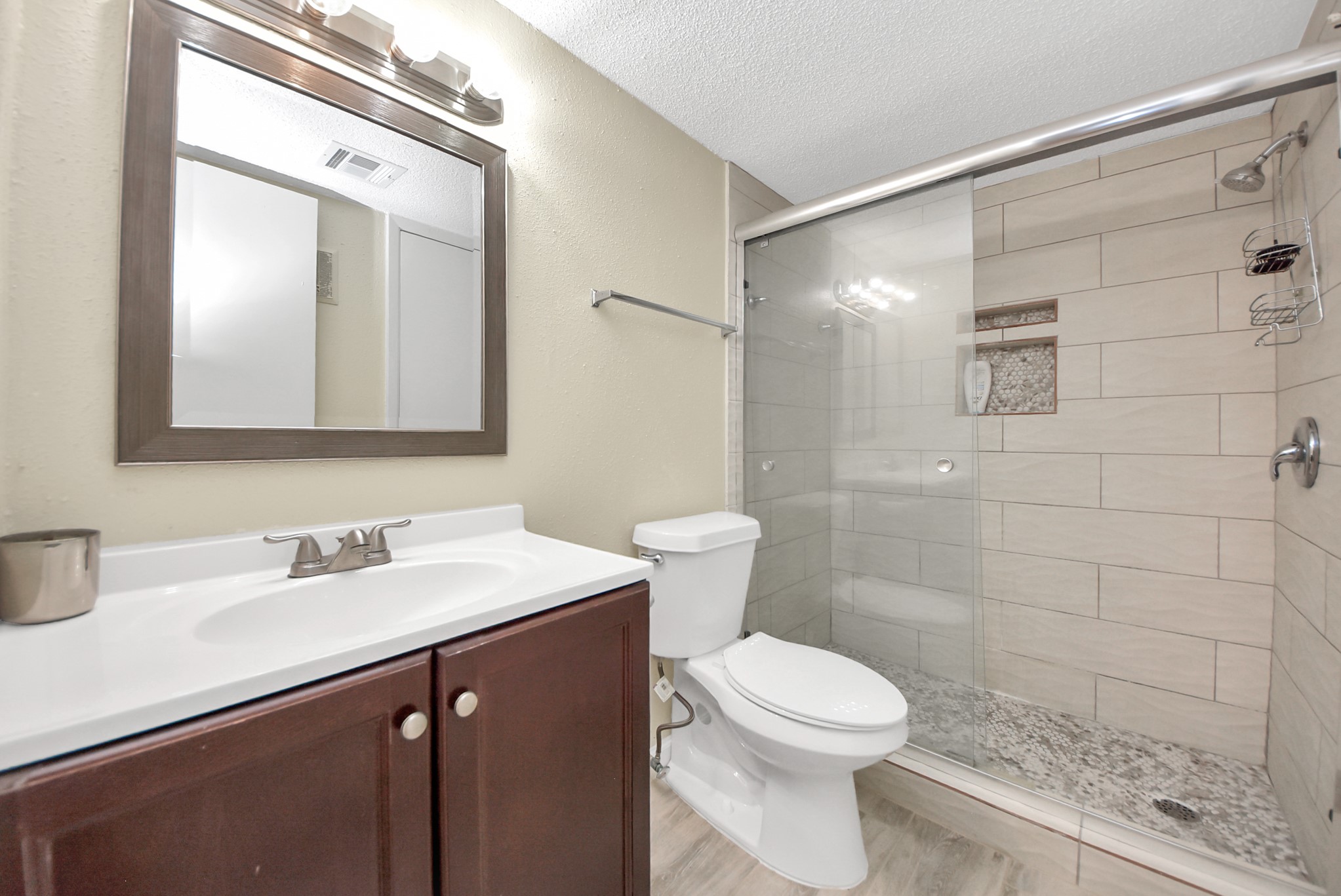 12232 Copper Tree Pvt Lane, Unit 122 Houston, TX 77035 - Photo 20 of 41 a bathroom with a sink a toilet and shower