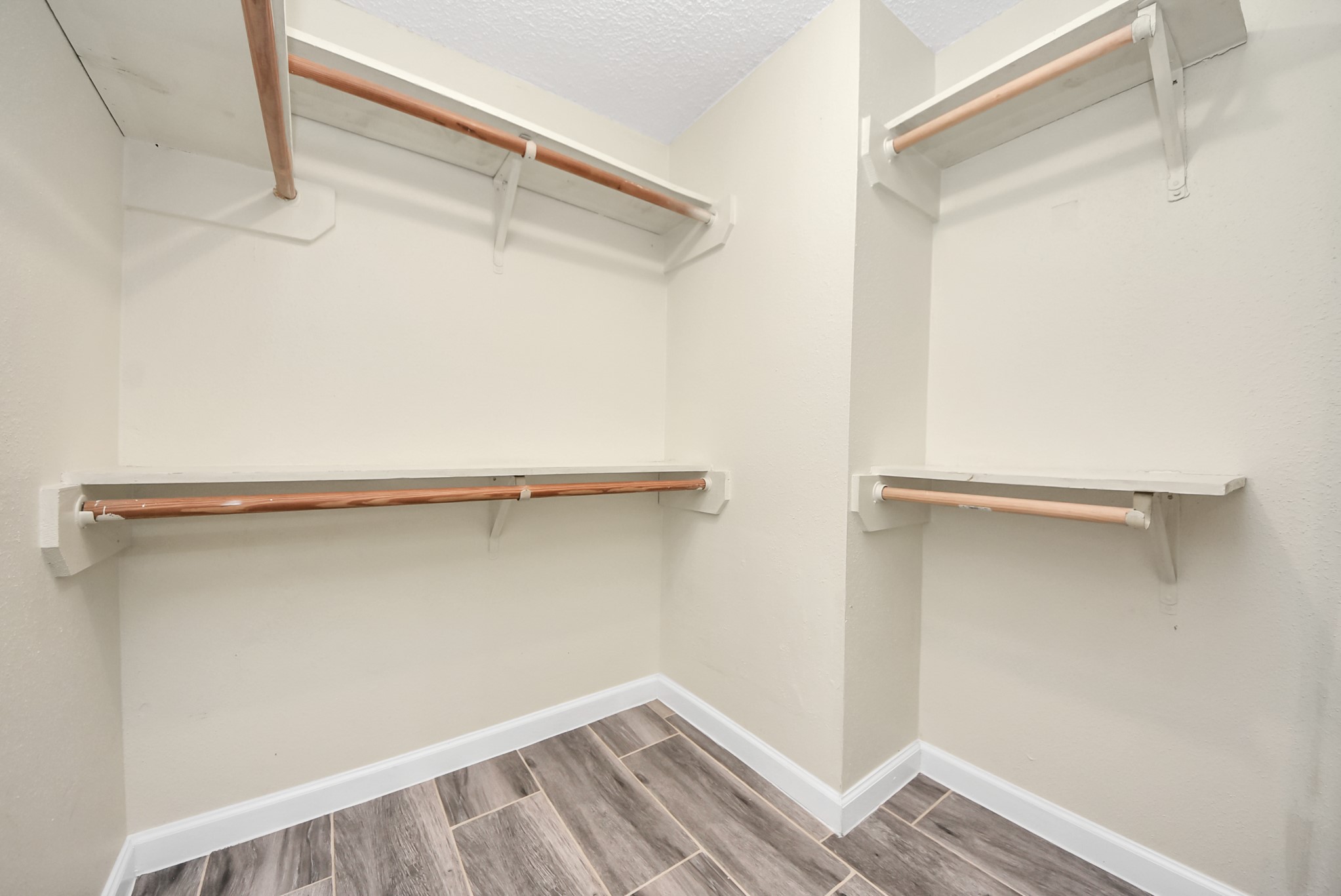 12232 Copper Tree Pvt Lane, Unit 122 Houston, TX 77035 - Photo 23 of 41 a view of a room with racks on the wall