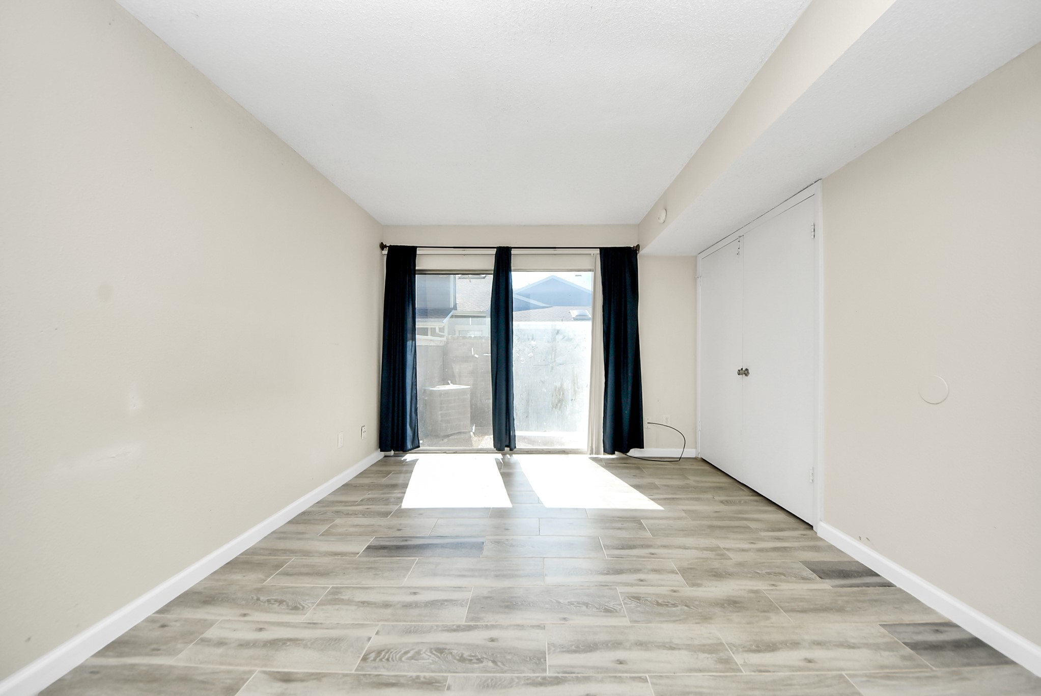 12232 Copper Tree Pvt Lane, Unit 122 Houston, TX 77035 - Photo 28 of 41 wooden floor in an empty room with a window