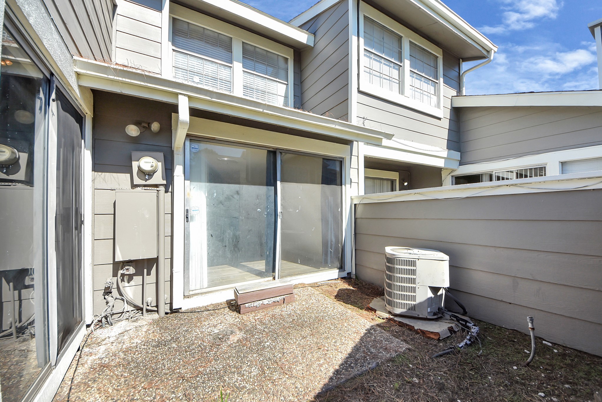12232 Copper Tree Pvt Lane, Unit 122 Houston, TX 77035 - Photo 29 of 41 a backyard of a house with barbeque oven and outdoor seating