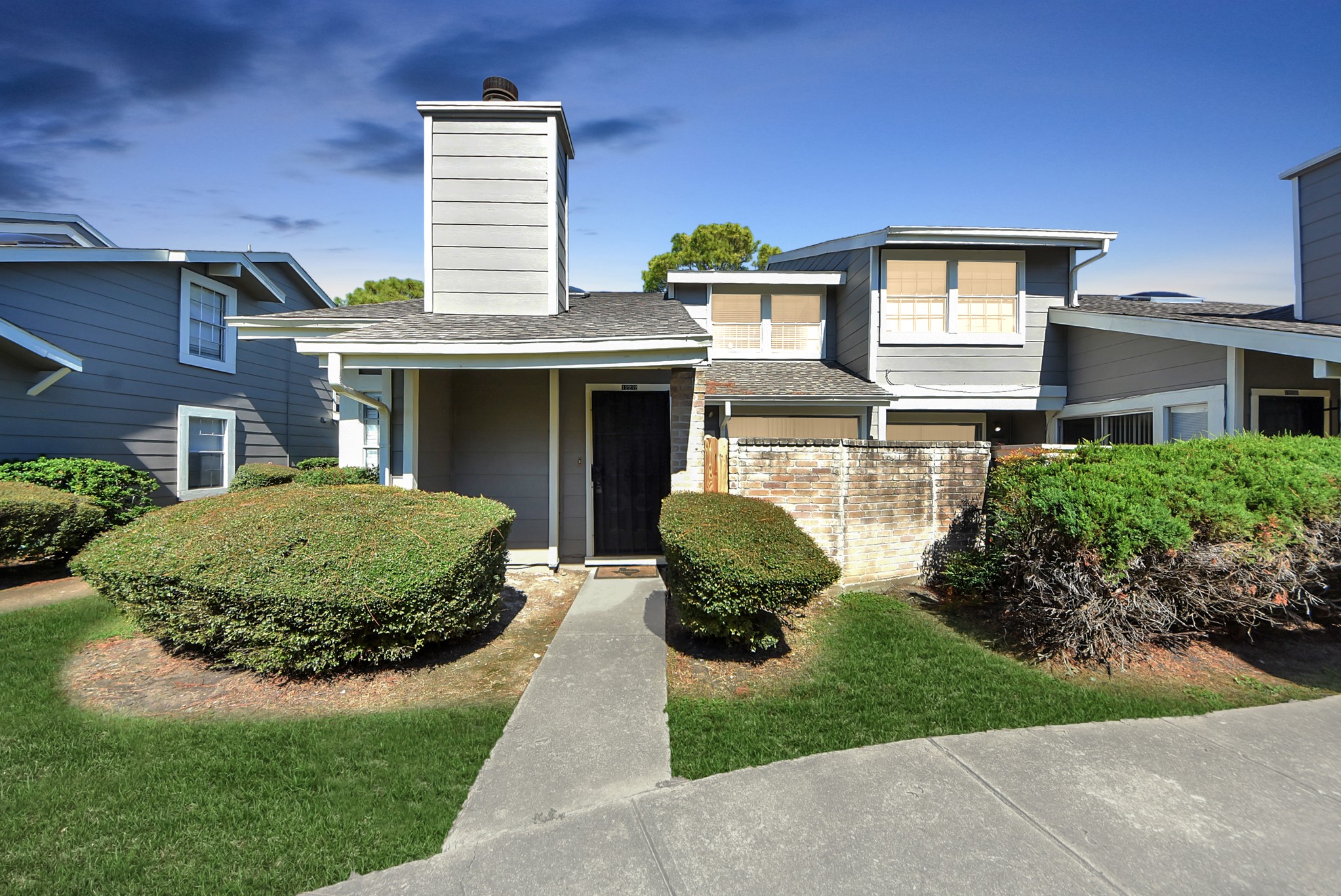 12232 Copper Tree Pvt Lane, Unit 122 Houston, TX 77035 - Photo 39 of 41 a front view of a house with a yard