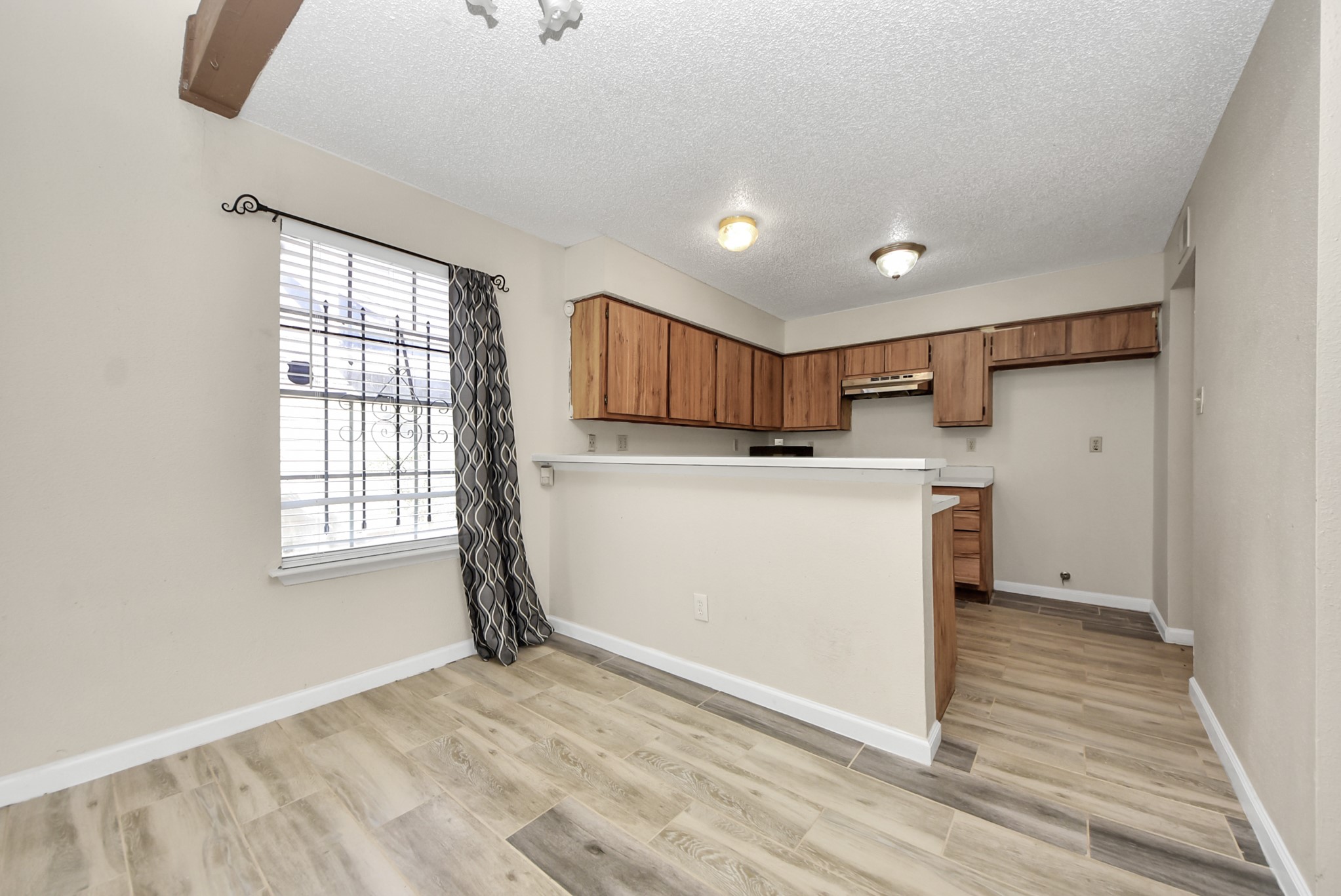 12232 Copper Tree Pvt Lane, Unit 122 Houston, TX 77035 - Photo 8 of 41 a view of a kitchen with a sink cabinets and a window