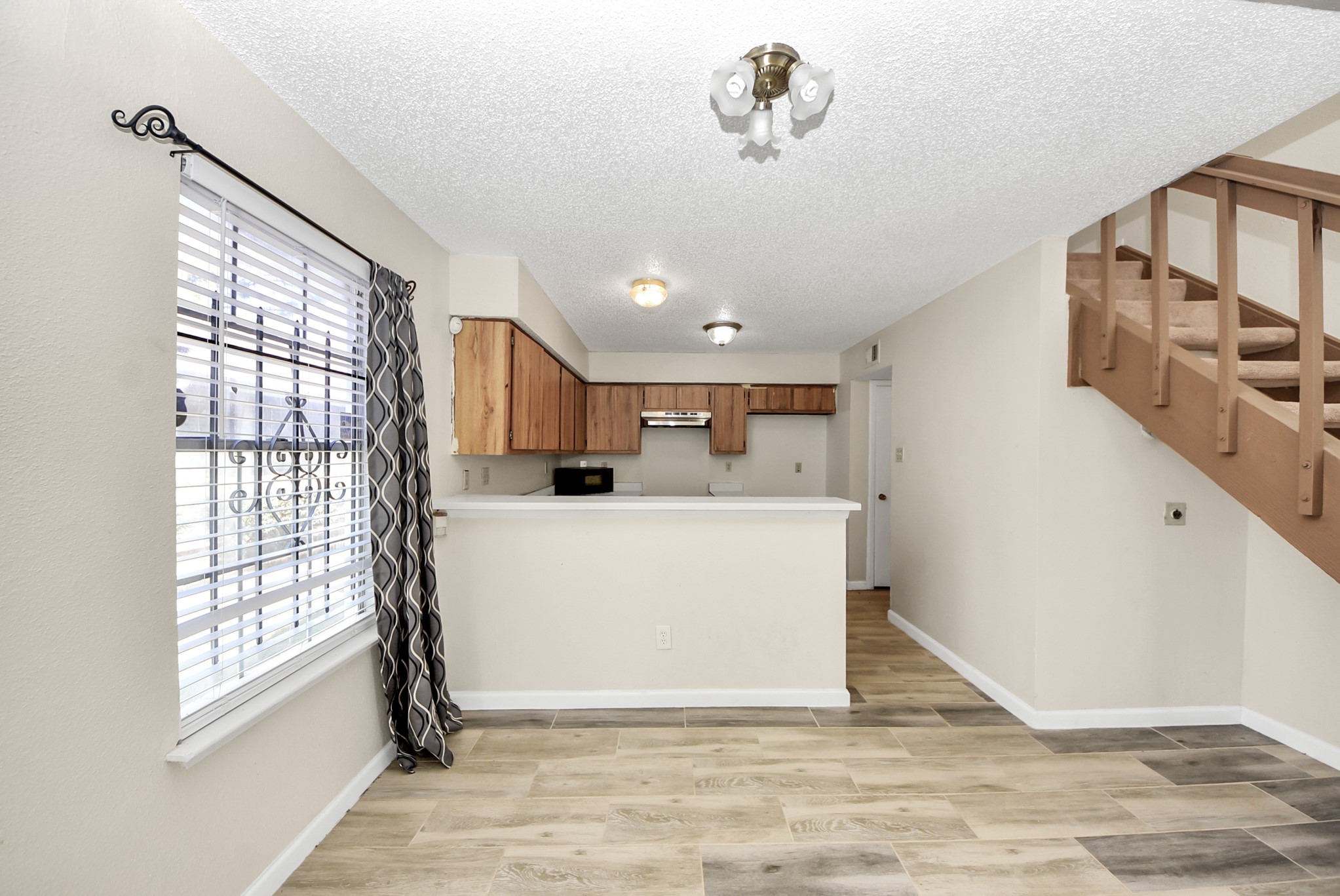 12232 Copper Tree Pvt Lane, Unit 122 Houston, TX 77035 - Photo 9 of 41 a view of livingroom with furniture and windows