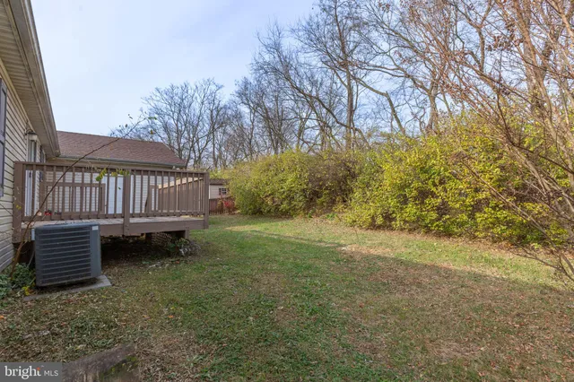 a view of a garden with wooden fence