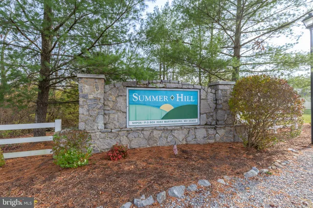a view of outdoor space with signage and flags