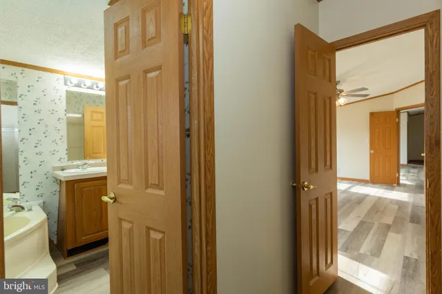 a view of a bathroom with a shower and a sink