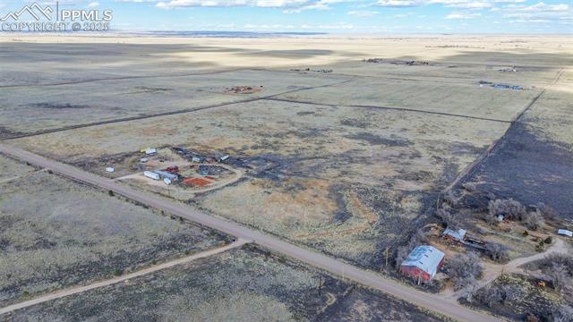 3815 Milne Road Colorado Springs, CO 80930 - Photo 7 of 14 Drone / aerial view featuring a rural view