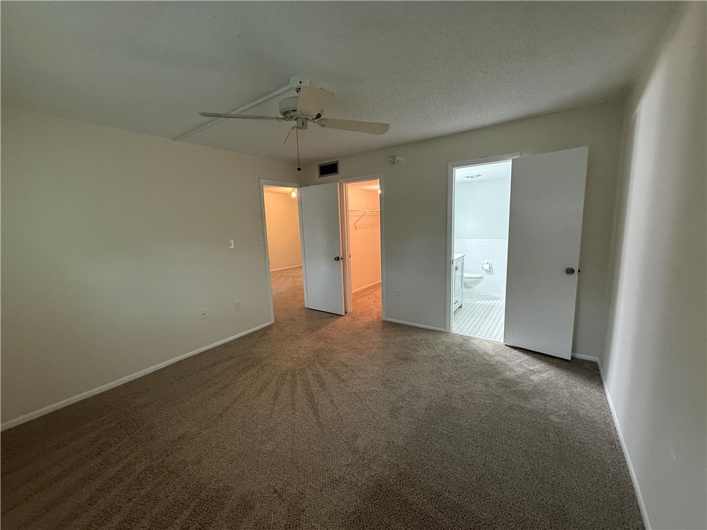 1100 Ponce De Leon Circle, Unit N208 Vero Beach, FL 32960 - Photo 12 of 16 an empty room with a empty space and windows