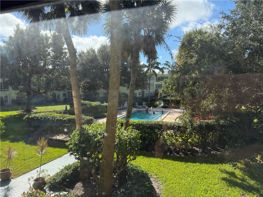 1100 Ponce De Leon Circle, Unit N208 Vero Beach, FL 32960 - Photo 2 of 16 a view of a back yard