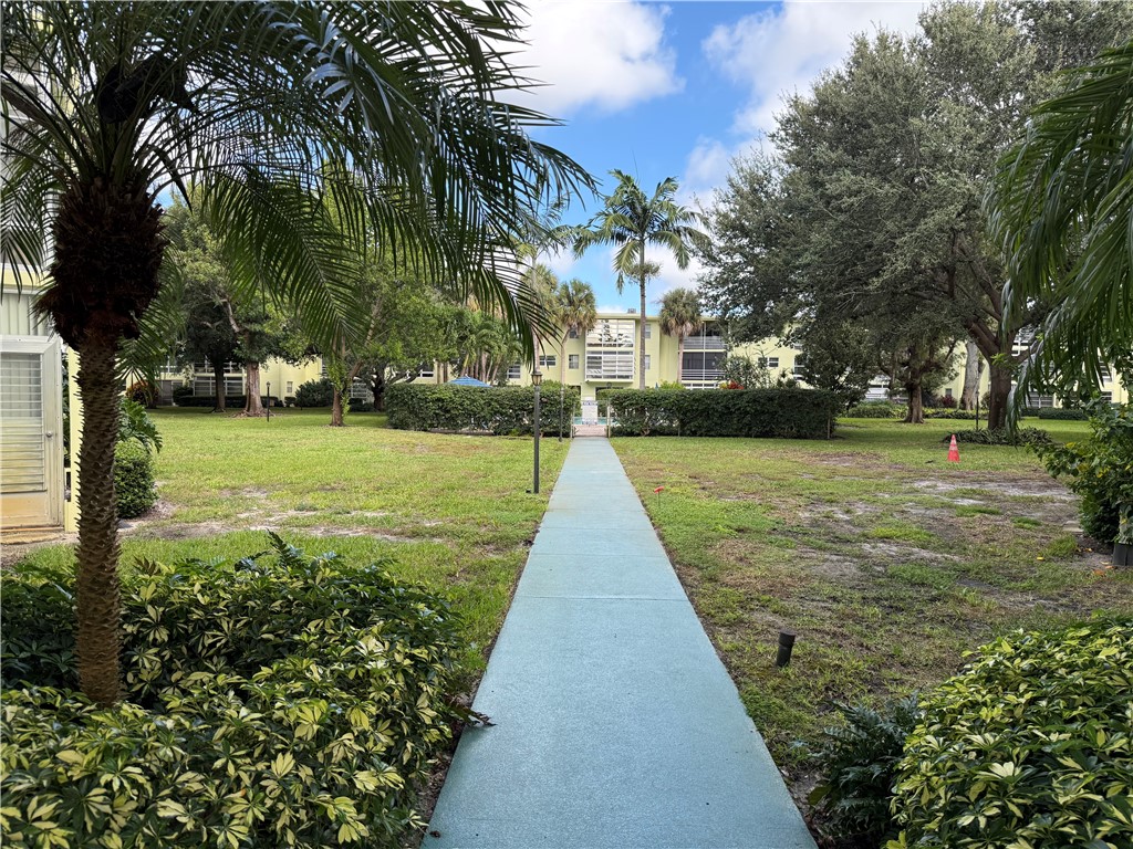 1100 Ponce De Leon Circle, Unit N208 Vero Beach, FL 32960 - Photo 3 of 16 a view of a park with a trees