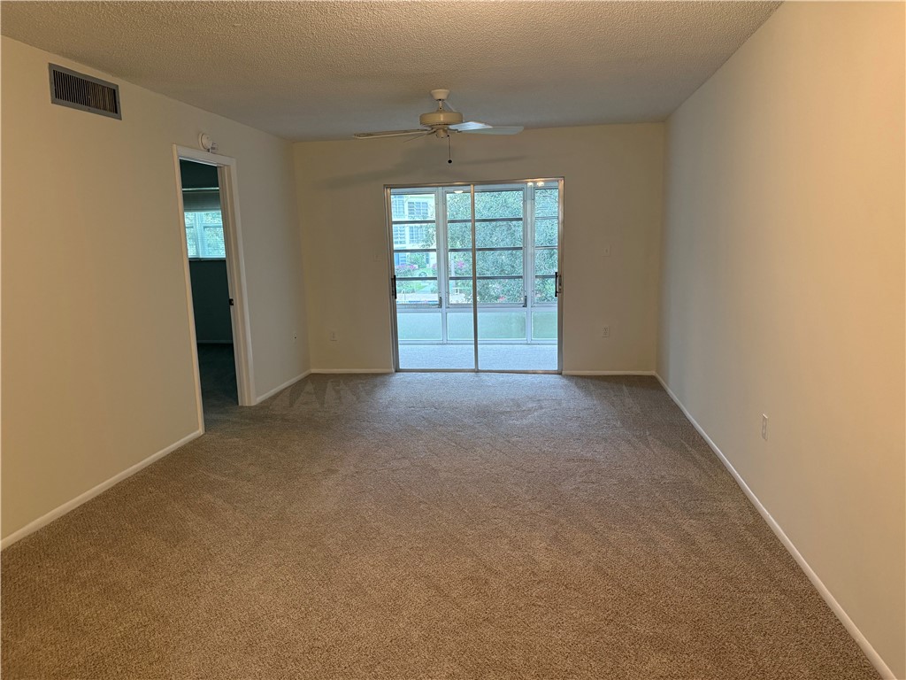 1100 Ponce De Leon Circle, Unit N208 Vero Beach, FL 32960 - Photo 10 of 16 an empty room with windows and closet