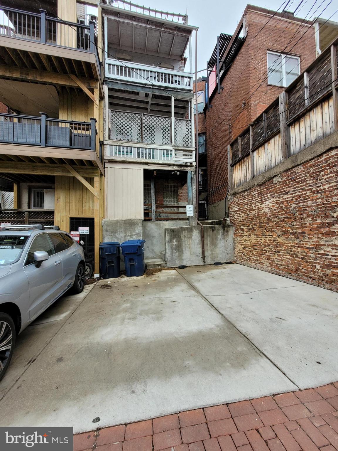 1944 Calvert Street Northwest Washington, DC 20009 - Photo 74 of 74 Rear of building with parking for 2 small cars