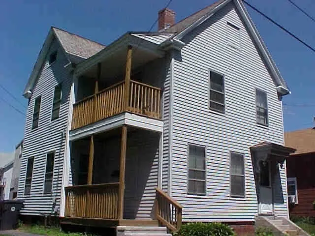 a view of a house with a door and deck