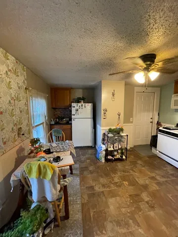 a bed room with furniture and a chandelier