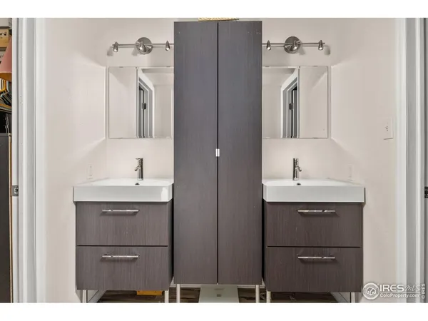 a bathroom with a sink a mirror and a bathtub