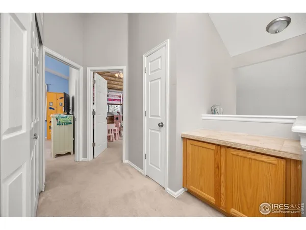 a bedroom with a bed a desk and chair
