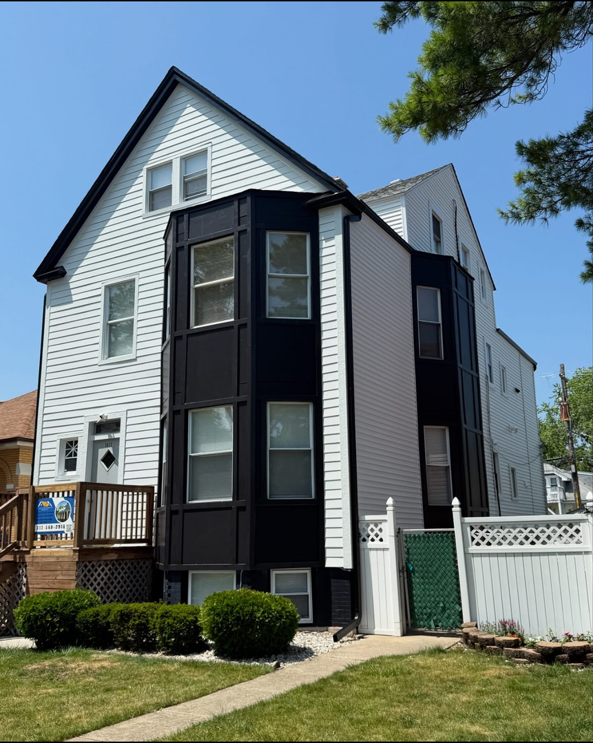 5632 West Berenice Avenue, Unit 3 Chicago, IL 60634 - Photo 1 of 6 a view of a house with backyard and garden