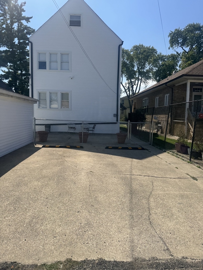 5632 West Berenice Avenue, Unit 3 Chicago, IL 60634 - Photo 2 of 6 a view of house with backyard and sitting area
