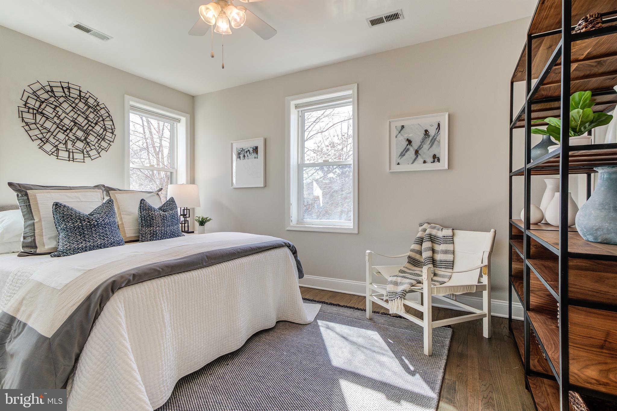 344 14th Street Southeast Washington, DC 20003 - Photo 19 of 31 a bedroom with a bed and a table in it