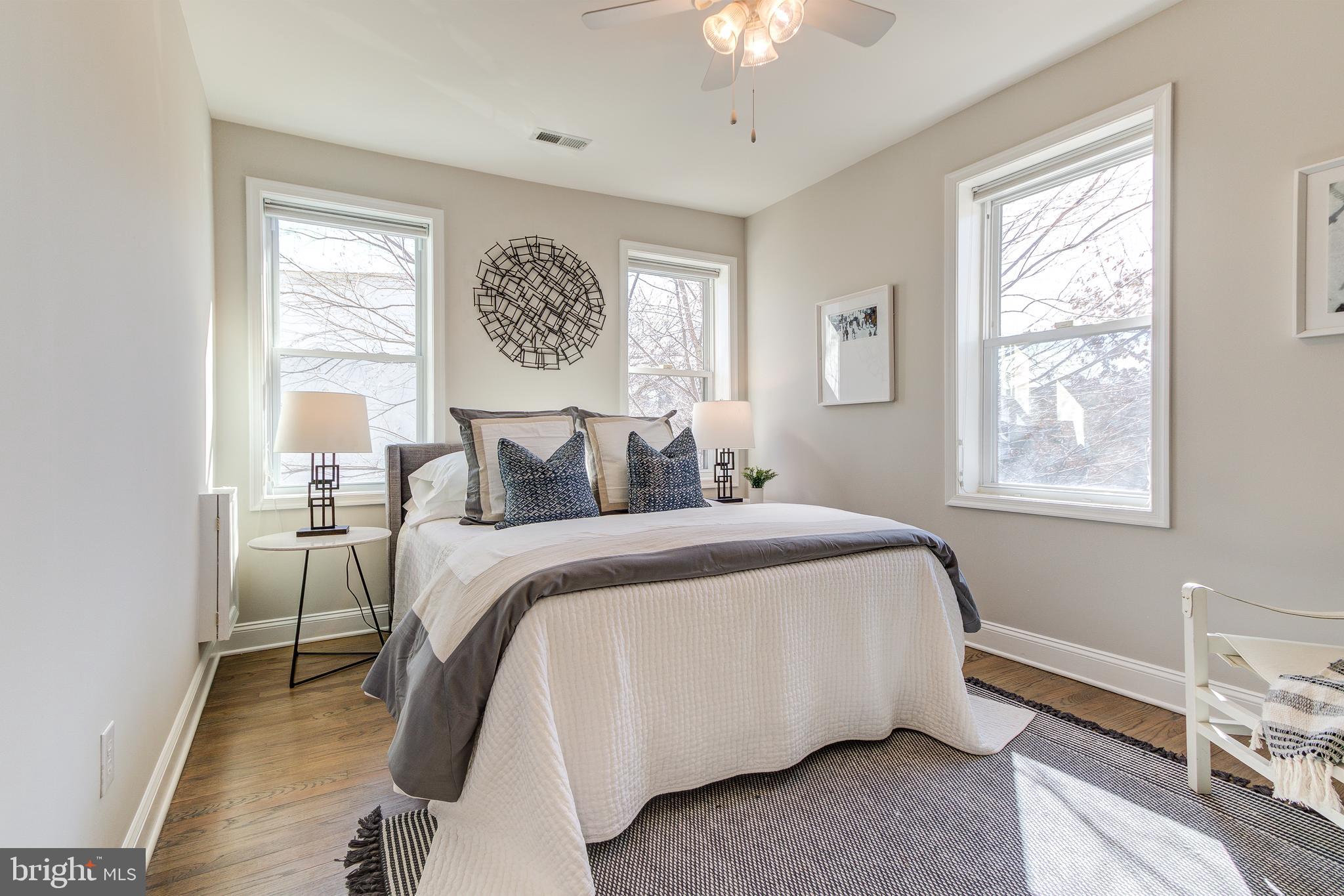 344 14th Street Southeast Washington, DC 20003 - Photo 20 of 31 a bedroom with a bed and a window